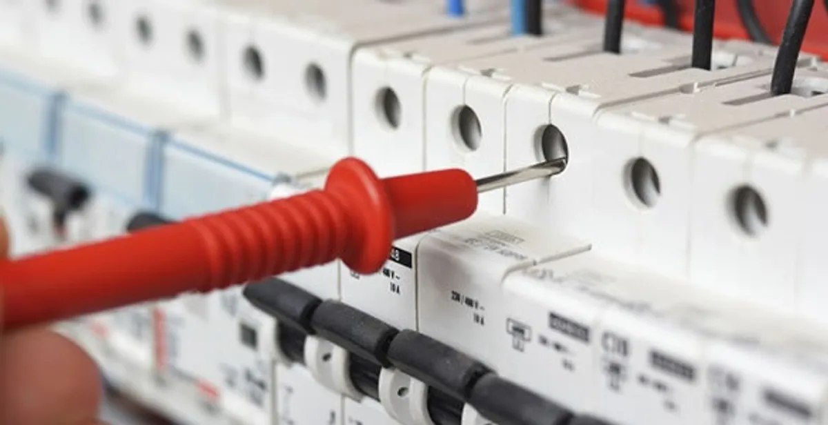 Electrical contractor testing circuit breakers during electrical repair in Avondale Estates, GA