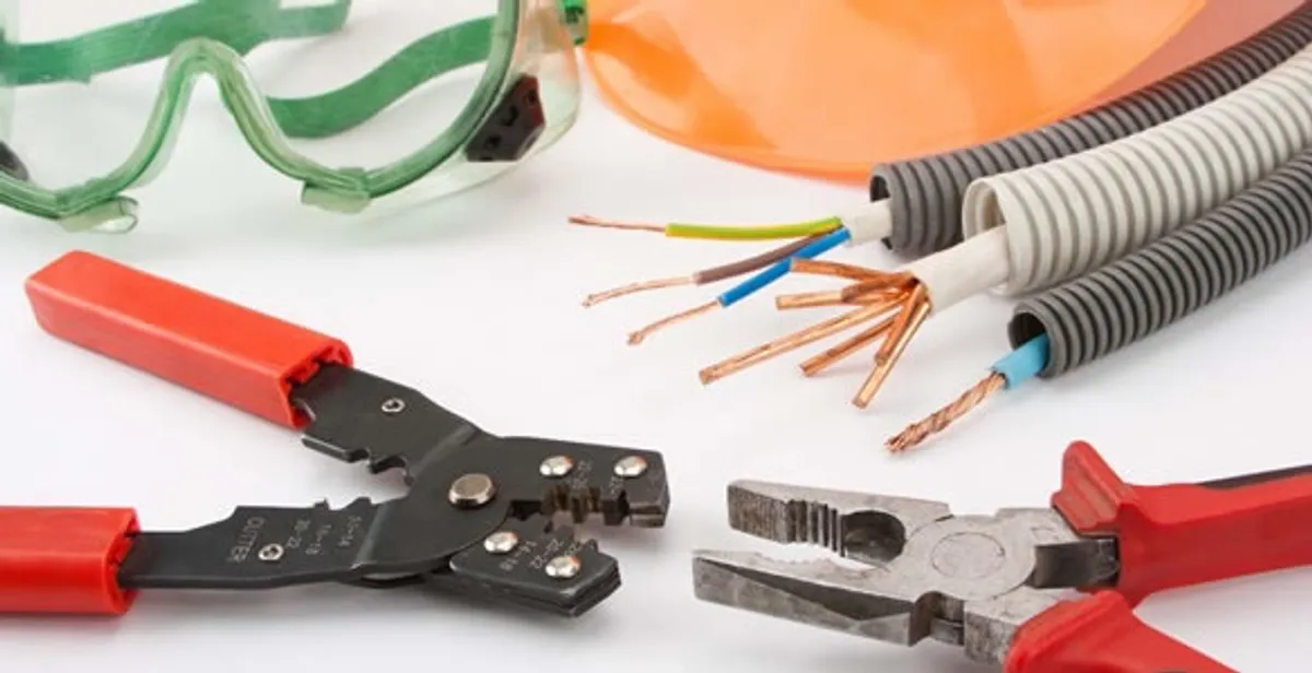 Electrical wiring repair with professional tools and safety equipment in Scottdale, GA