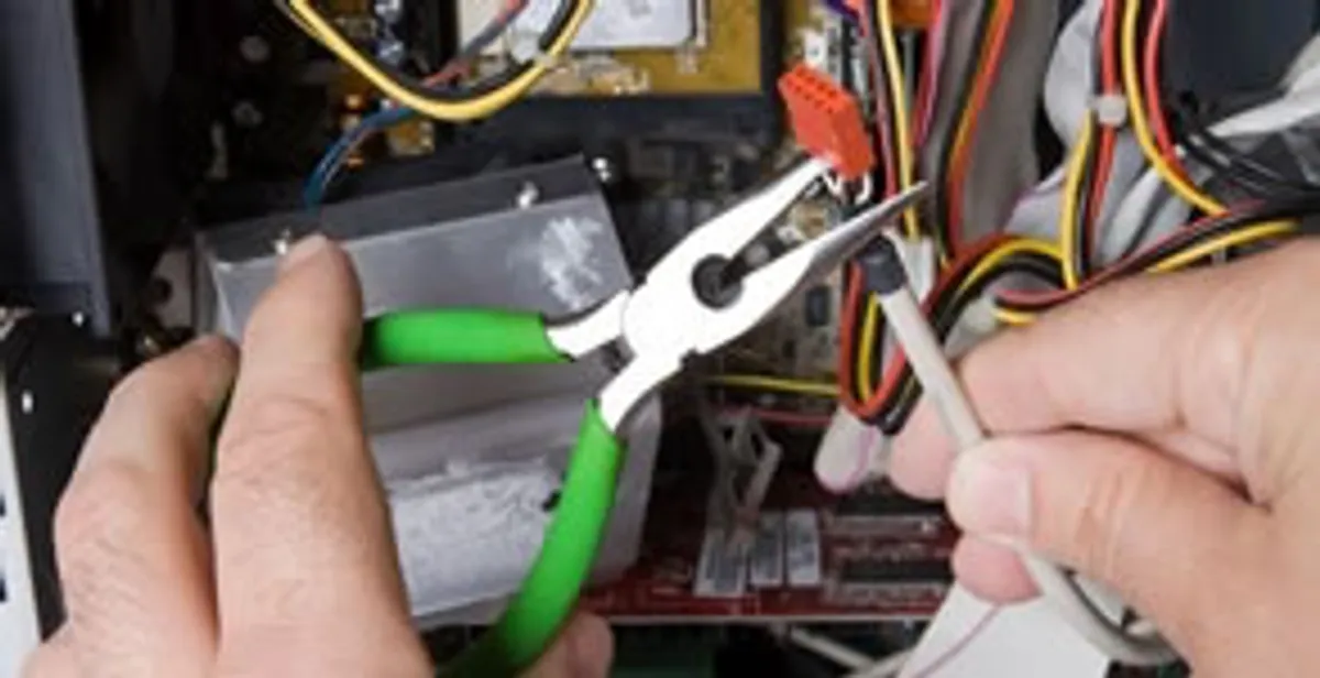 Licensed electrical contractor performing electrical repair with tools in Smyrna, GA