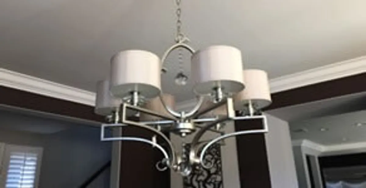 Modern chandelier installation with multiple light fixtures in Atlanta, GA
