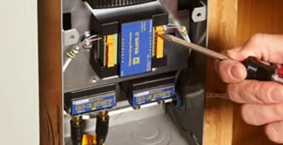 Whole home surge protection device being installed by a licensed electrician to protect electrical systems in Atlanta, GA